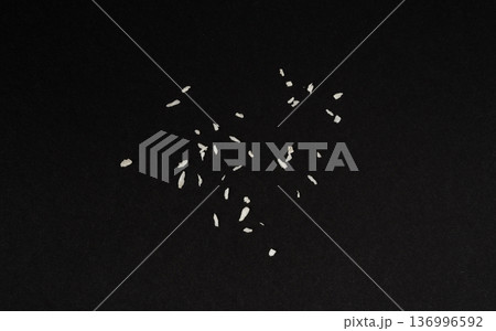 Grated coconut powder. Dry coco flakes pile, shredded desiccated coconut, tropical fruit chips 136996592