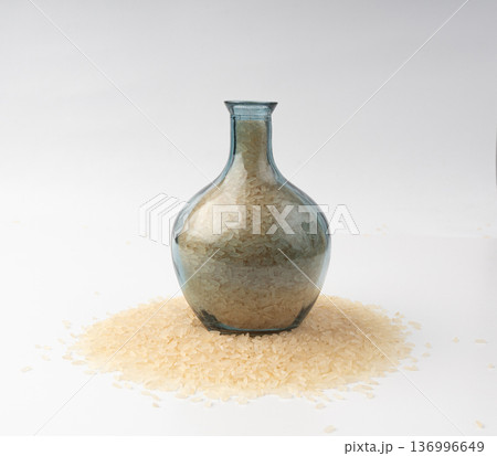 White parboiled rice grains. Dry uncooked ponni rice, small organic basmati 136996649