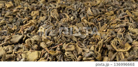 Green tea leaves macro textured background Green tea leaves macro textured background 136996668