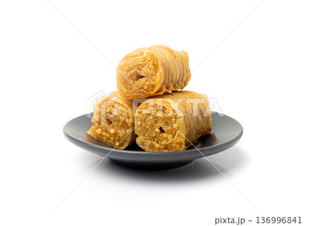 Rolled Baklava Isolated, Ramadan Dessert Roll on Restaurant Plate, Eastern Sweet Pastries Rolled Baklava Isolated, Ramadan Dessert Roll on Restaurant Plate, Eastern Sweet Pastries 136996841