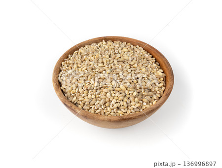 Pearl barley grains. Raw peeled cereal pile texture, organic pearl barley 136996897