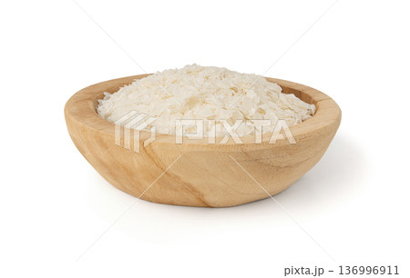 Raw flattened rice isolated. Dry rice flakes or poha, Indian breakfast food 136996911