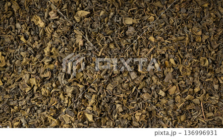 Green tea leaves macro textured background Green tea leaves macro textured background 136996931