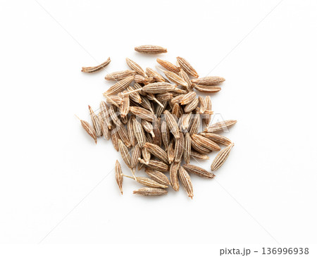 Cumin seed isolated. Caraway or fennel dry seeds close up, zeera macro, Indian cumin or zira grains Cumin seed isolated. Caraway or fennel dry seeds close up, zeera macro, Indian cumin or zira grains 136996938
