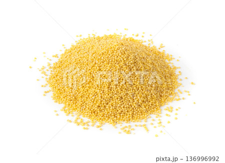 Raw millet grains pile isolated. Little yellow cereal, natural foxtail small seeds 136996992