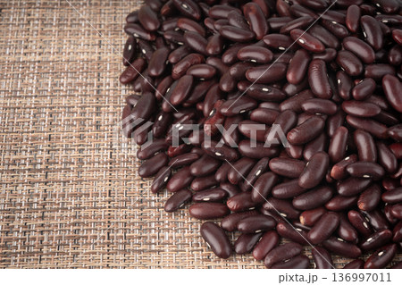 Red dry kidney beans. Uncooked bean pile, raw legume or red beans, rajma Red dry kidney beans. Uncooked bean pile, raw legume or red beans, rajma 136997011