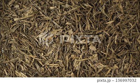 Green tea leaves macro textured background 136997032