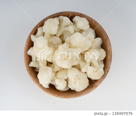 Steamed cauliflower pieces close up Steamed cauliflower pieces close up 136997076