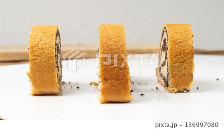 Poppy Seed Swiss Roll, Round Sponge Cake Isolated, Sliced Rolled Vanilla Biscuit with Poppy Seeds Filling Poppy Seed Swiss Roll, Round Sponge Cake Isolated, Sliced Rolled Vanilla Biscuit with Poppy Seeds Filling 136997080
