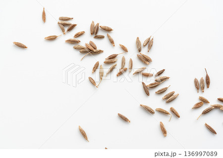 Cumin seed isolated. Caraway or fennel dry seeds close up, zeera macro, Indian cumin or zira grains Cumin seed isolated. Caraway or fennel dry seeds close up, zeera macro, Indian cumin or zira grains 136997089