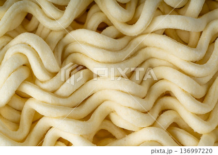 Instant noodles texture background, dry ramen noodle macro pattern 136997220