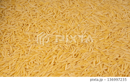 Raw orzo pasta, risoni or kritharaki pile Raw orzo pasta, risoni or kritharaki pile 136997235