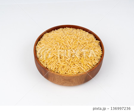 Raw orzo pasta, risoni or kritharaki pile 136997236