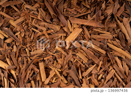 Broken ceylon cinnamon macro texture, cinnamomum verum bark pieces pattern Broken ceylon cinnamon macro texture, cinnamomum verum bark pieces pattern 136997436