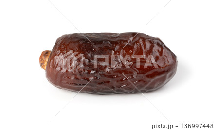 Macro close-up of a dry date isolated Macro close-up of a dry date isolated 136997448