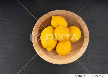 Old dried lemons. Fruits with darkened skins Old dried lemons. Fruits with darkened skins 136997476