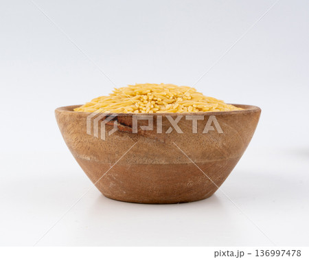 Raw orzo pasta, risoni or kritharaki pile 136997478