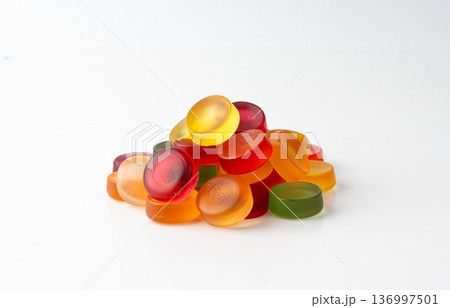 Round gummy candy pile isolated. Chewing colorful marmalade pills, jelly gumdrops heap 136997501