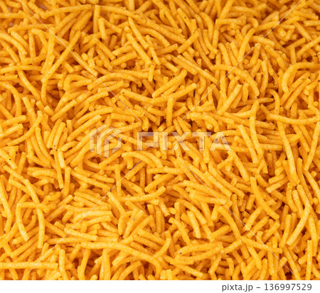 Aloo bhujia indian snack isolated. Crispy potato and chickpea flour strips, alu bhujiya sev Aloo bhujia indian snack isolated. Crispy potato and chickpea flour strips, alu bhujiya sev 136997529