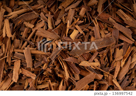 Broken ceylon cinnamon macro texture, cinnamomum verum bark pieces pattern 136997542