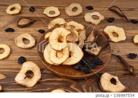 Dry fruit mix in bowl. Dried fruit chips Dry fruit mix in bowl. Dried fruit chips 136997554