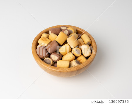 Filled dog biscuits, crackers isolated, soft crunchy pet treats pile, flavored small canine cookie 136997586