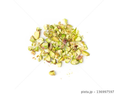 Fried salt pistachio nuts isolated. Baked pistachios pile, roasted green pistache fruits on white Fried salt pistachio nuts isolated. Baked pistachios pile, roasted green pistache fruits on white 136997597