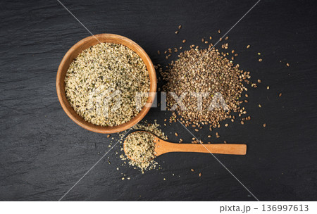 Shelled hemp seeds pile, peeled cannabis grains, marijuana kernels without peel 136997613