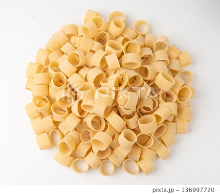 Raw Calamarata Big Pasta Isolated, Homemade Dry Macaroni, Italian Raw Round Noodle Raw Calamarata Big Pasta Isolated, Homemade Dry Macaroni, Italian Raw Round Noodle 136997720