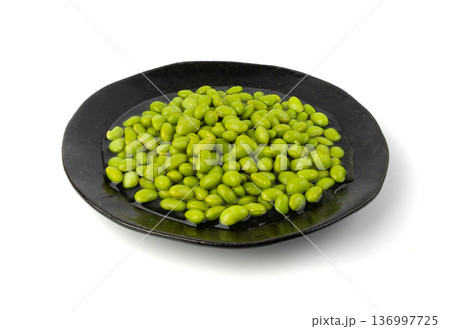 Edamame beans isolated. Green soy bean pile, cooked young soybean, boiled Japanese pea 136997725