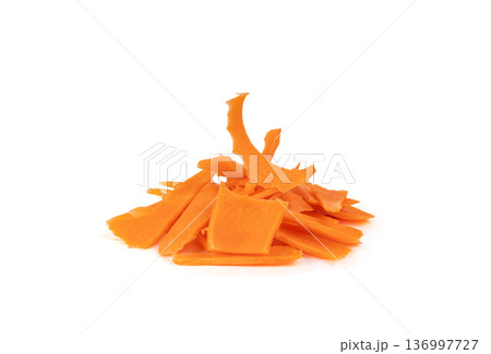 Finely chopped pieces of fresh carrots isolated Finely chopped pieces of fresh carrots isolated 136997727