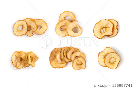 Dry apple slices isolated, dried apple chips, healthy fruit snack 136997741