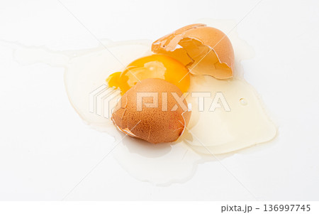 Broken Egg Isolated, Raw Yolk and White, Cracked Brown Shell, Fresh Broken Chicken Eggs on White Background Broken Egg Isolated, Raw Yolk and White, Cracked Brown Shell, Fresh Broken Chicken Eggs on White Background 136997745