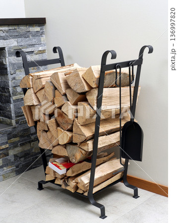 Firewood on metal stand 136997820