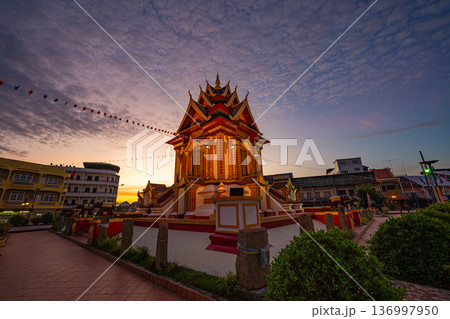 Dawn Illumination of Pakse Shrine Under Drifting Clouds 136997950