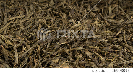 Green tea leaves macro textured background 136998098