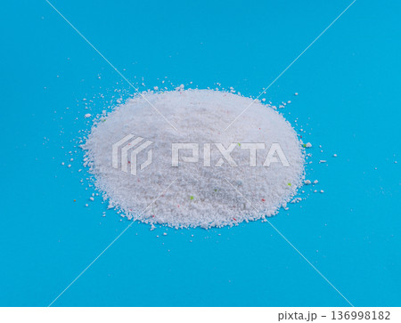 Detergent powder pile. Laundry washing soap granules, small white texture of oxygen bleach 136998182