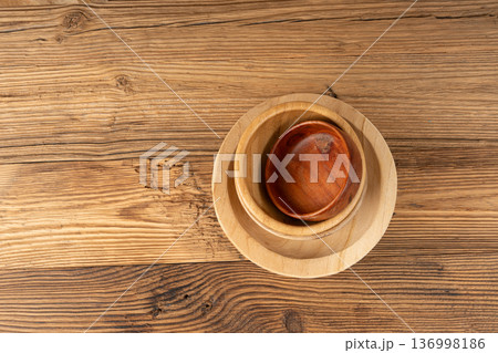 Empty wood bowl on table, plate stack on wooden table, light rustic dish mockup, eco bio Empty wood bowl on table, plate stack on wooden table, light rustic dish mockup, eco bio 136998186