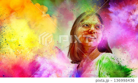 Woman with glasses in bright Holi powder explosion background. 136998436