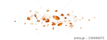 Crushed almonds falling isolated, flying nut pieces, levitate scattered almond seeds 136998873