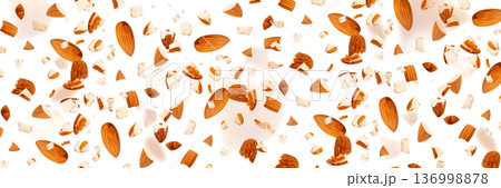 Crushed almonds falling isolated, flying nut pieces, levitate scattered almond seeds 136998878