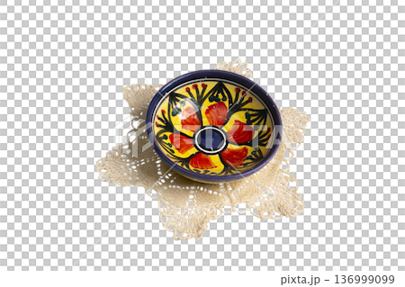 a small hand-painted bowl on a crocheted doily a small hand-painted bowl on a crocheted doily 136999099