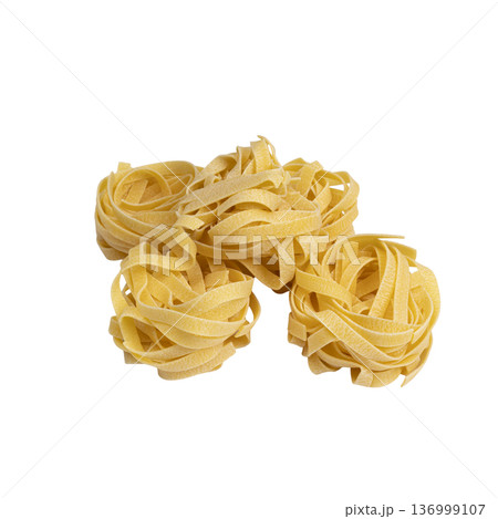 uncooked tagliatelle pasta uncooked tagliatelle pasta 136999107