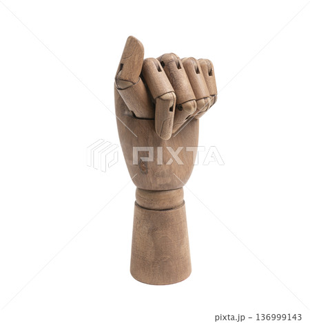 a wooden hand making a closed fist gesture 136999143