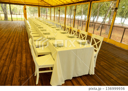 Long banquet table in event tent 136999936