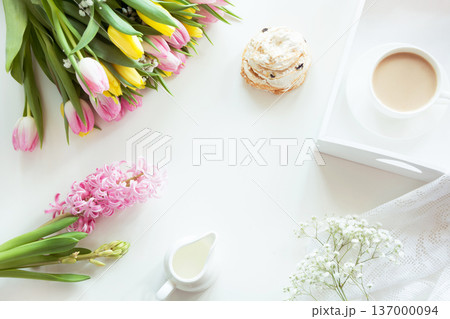 Spring morning breakfast, coffee, milk jug and cake with decor of pink hyacinth. Spring morning breakfast, coffee, milk jug and cake with decor of pink hyacinth. 137000094