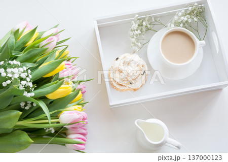 Spring morning breakfast, coffee, milk jug and cake with decor of pink hyacinth. Spring morning breakfast, coffee, milk jug and cake with decor of pink hyacinth. 137000123