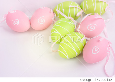 Easter pink and green painted eggs on white and copy space. Easter pink and green painted eggs on white and copy space. 137000132