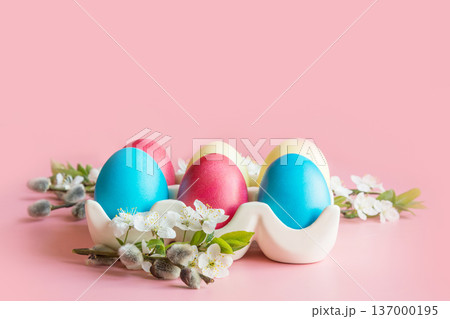 Colorful eggs with spring flowers in porcelain box. Easter. Spring. Close up. 137000195