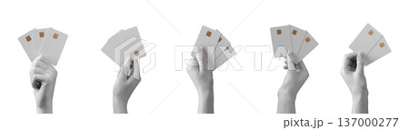 Hands holding plastic bank cards isolated background. Payment finance gesture showing credit debit cards. Shopping transaction business concept.. Hands holding plastic bank cards isolated background. Payment finance gesture showing credit debit cards. Shopping transaction business concept.. 137000277